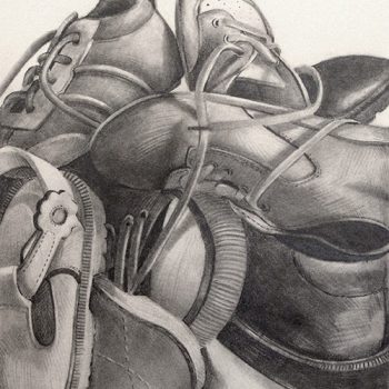 A still life drawing in graphite of a pile of shoes.