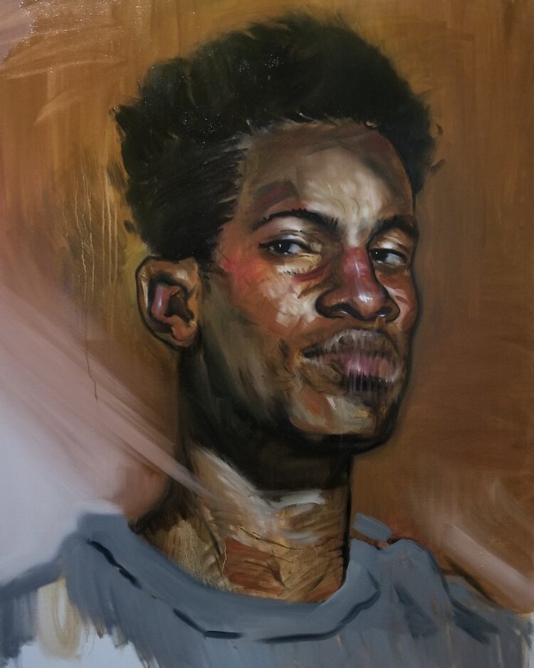 Portrait of a young black man with a sly gaze